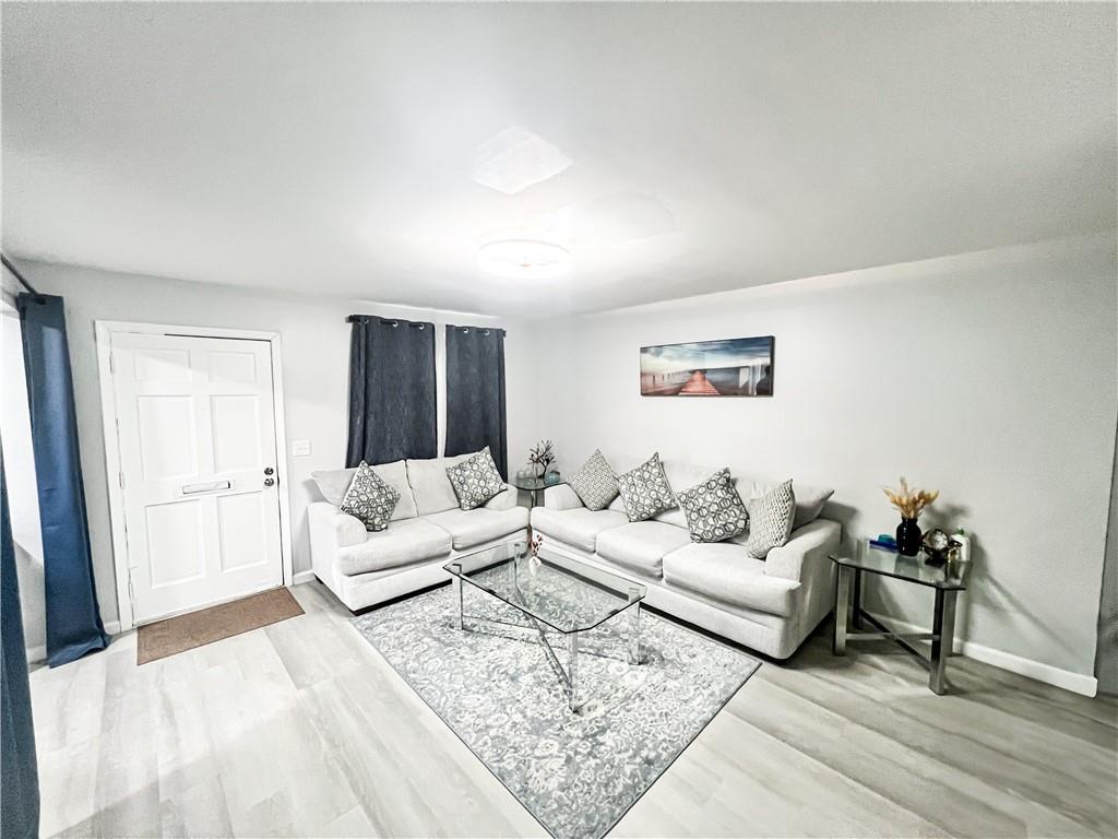 3549 Old Chamblee Tucker Road, Unit J Atlanta, GA 30340 - Photo 25 of 61 a living room with furniture and a couch