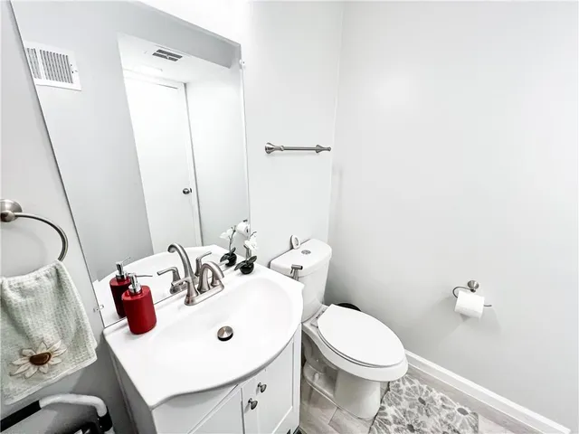 a kitchen with stainless steel appliances granite countertop a refrigerator and a stove