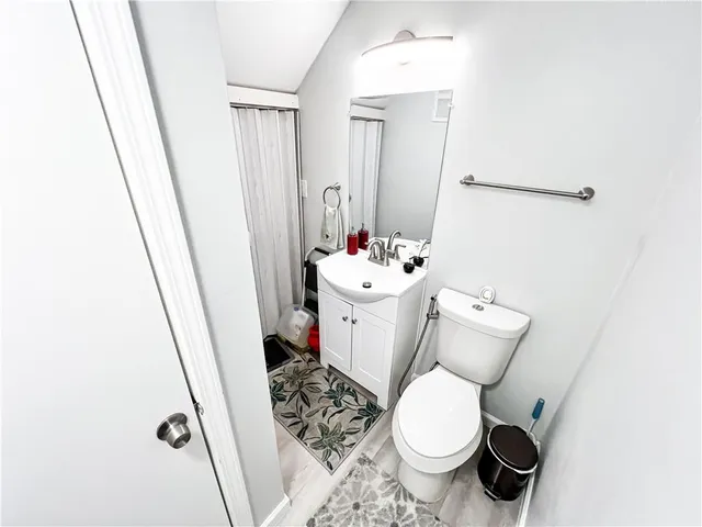 a kitchen with stainless steel appliances granite countertop a refrigerator a stove and a sink