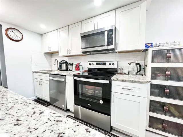 a view of a workspace with furniture