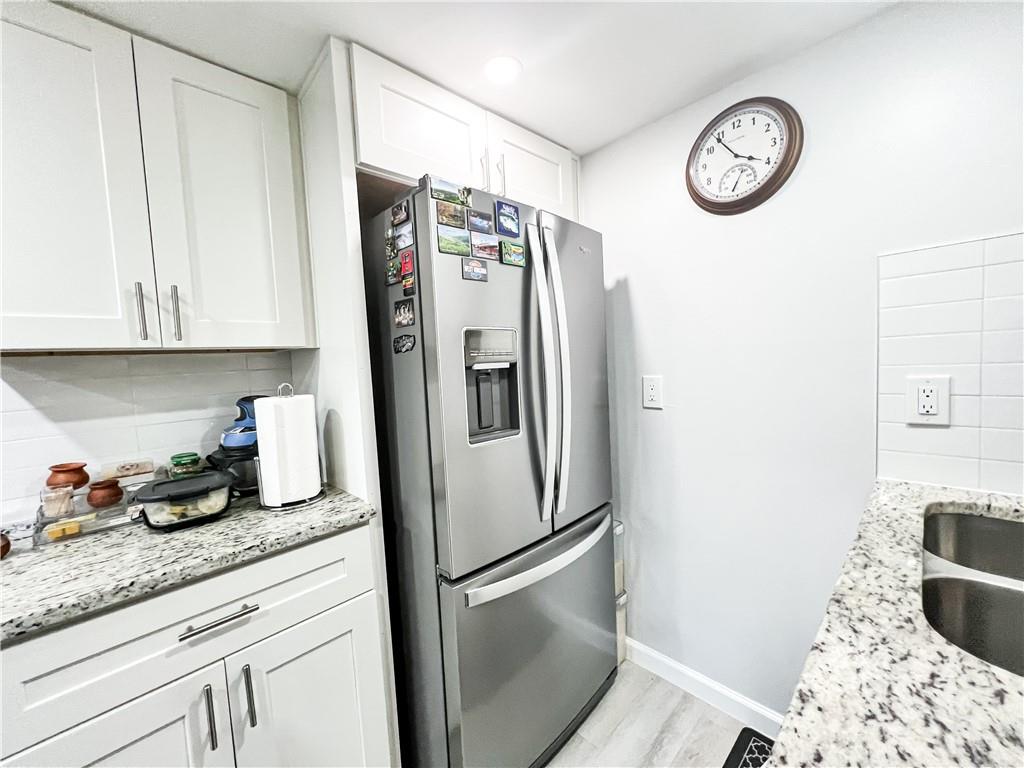 3549 Old Chamblee Tucker Road, Unit J Atlanta, GA 30340 - Photo 33 of 61 a kitchen with stainless steel appliances granite countertop a refrigerator and a stove