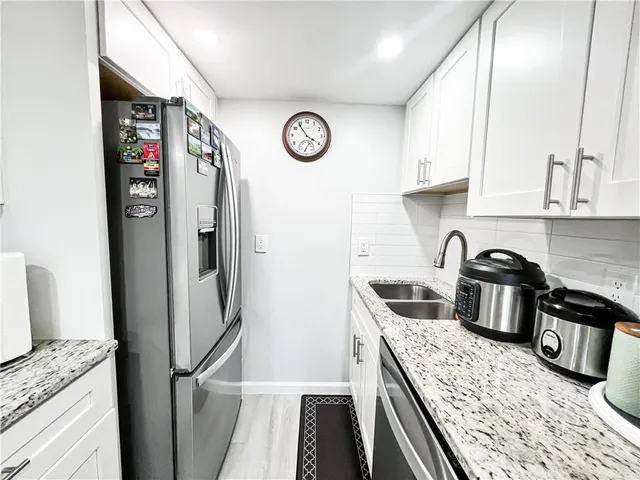 a living room with furniture and flat screen tv