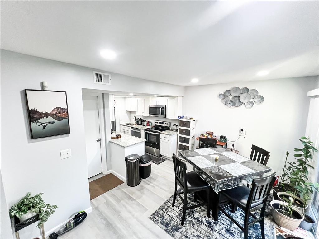 3549 Old Chamblee Tucker Road, Unit J Atlanta, GA 30340 - Photo 36 of 61 a view of a dining room with furniture