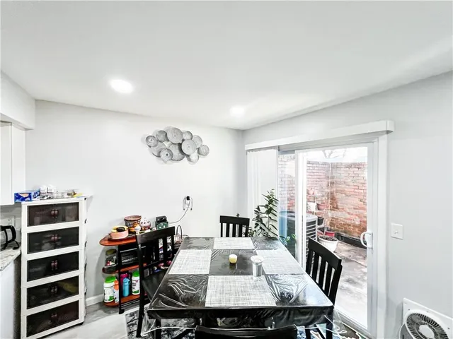 a room with a dresser and a window