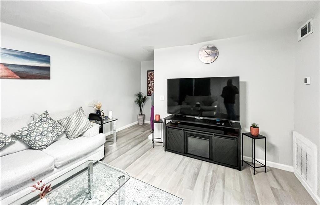 3549 Old Chamblee Tucker Road, Unit J Atlanta, GA 30340 - Photo 40 of 61 a living room with furniture and flat screen tv