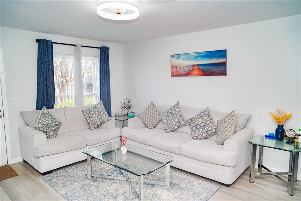 3549 Old Chamblee Tucker Road, Unit J Atlanta, GA 30340 - Photo 52 of 61 a living room with furniture and a large window
