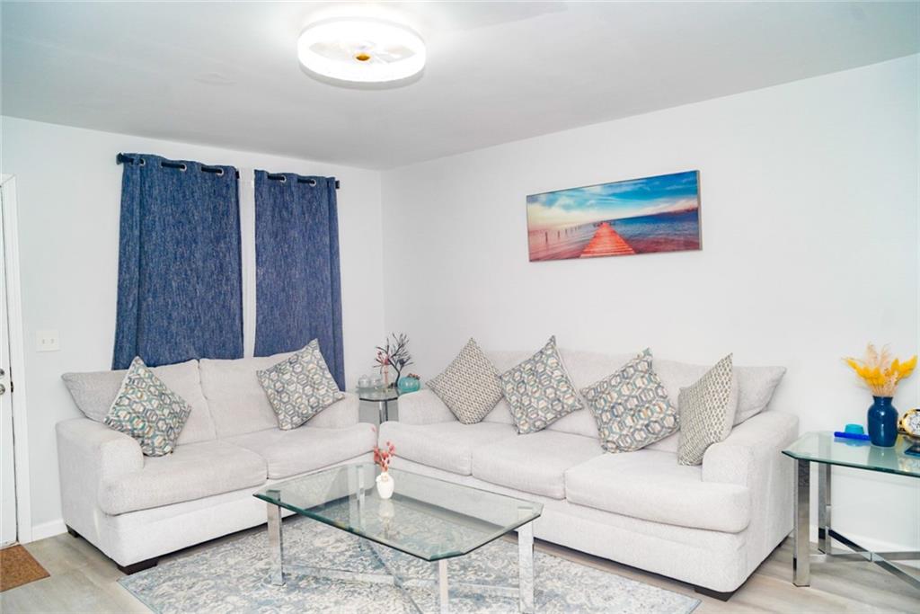 3549 Old Chamblee Tucker Road, Unit J Atlanta, GA 30340 - Photo 53 of 61 a living room with furniture and a couch