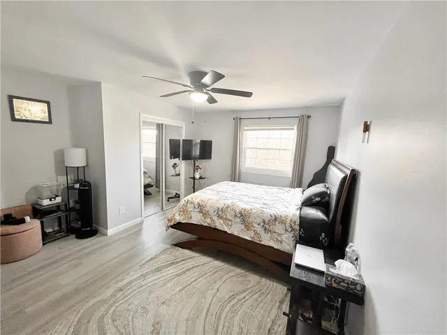 a bedroom with a bed and window