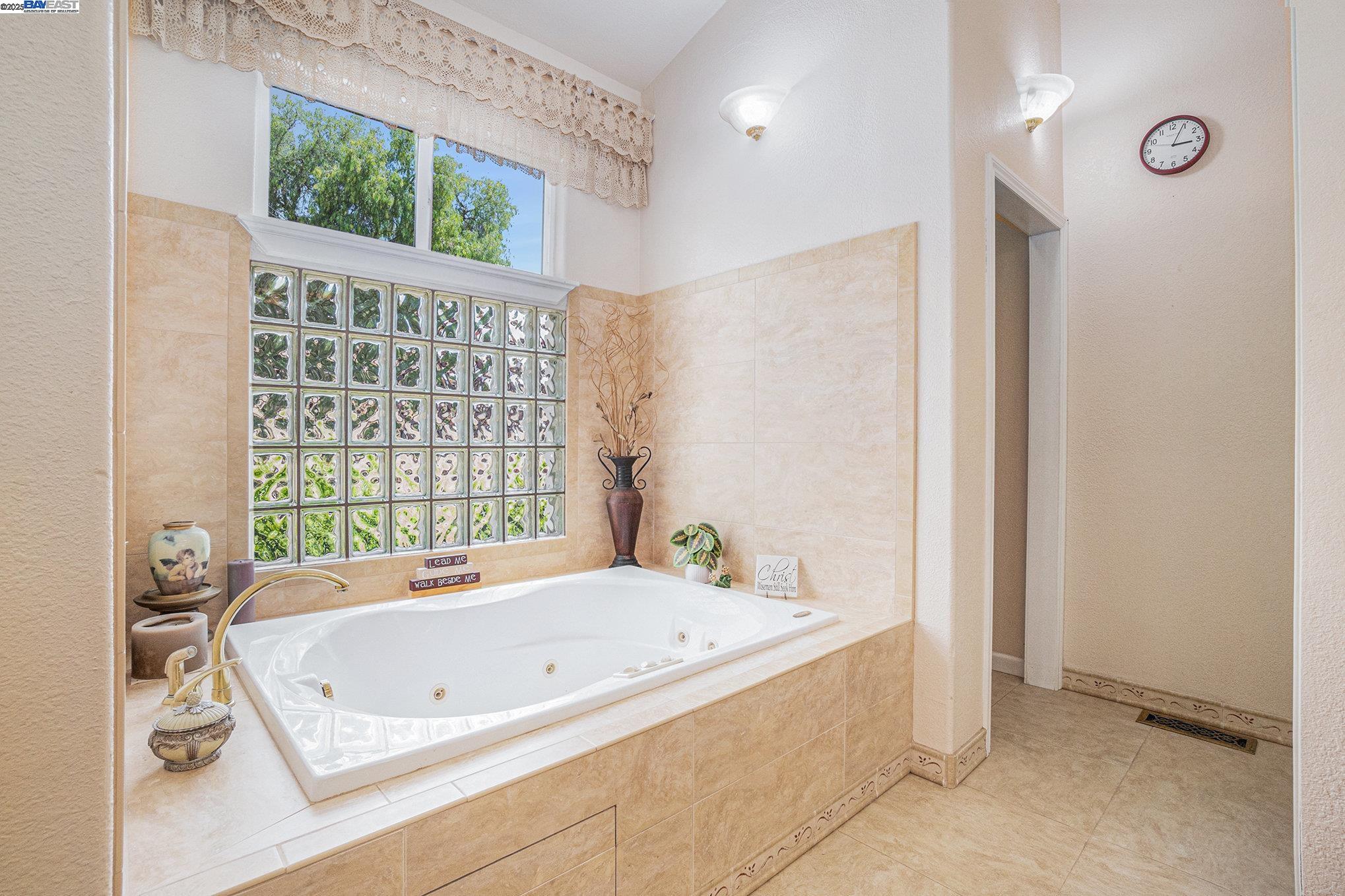 5799 Nortonville Road Pittsburg, CA 94565 - Photo 26 of 59 a bathroom with a bath tub and a shower