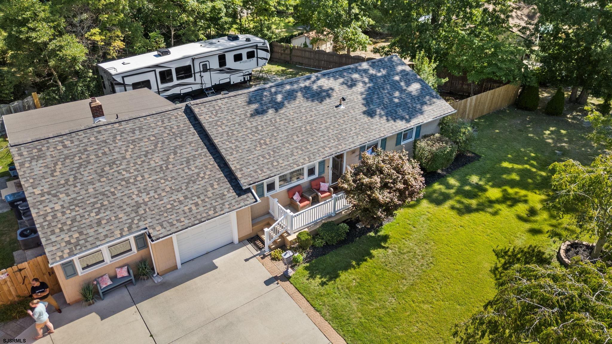 210 Mill Road Absecon, NJ 08201 - Photo 2 of 52 an aerial view of a house with swimming pool and large trees