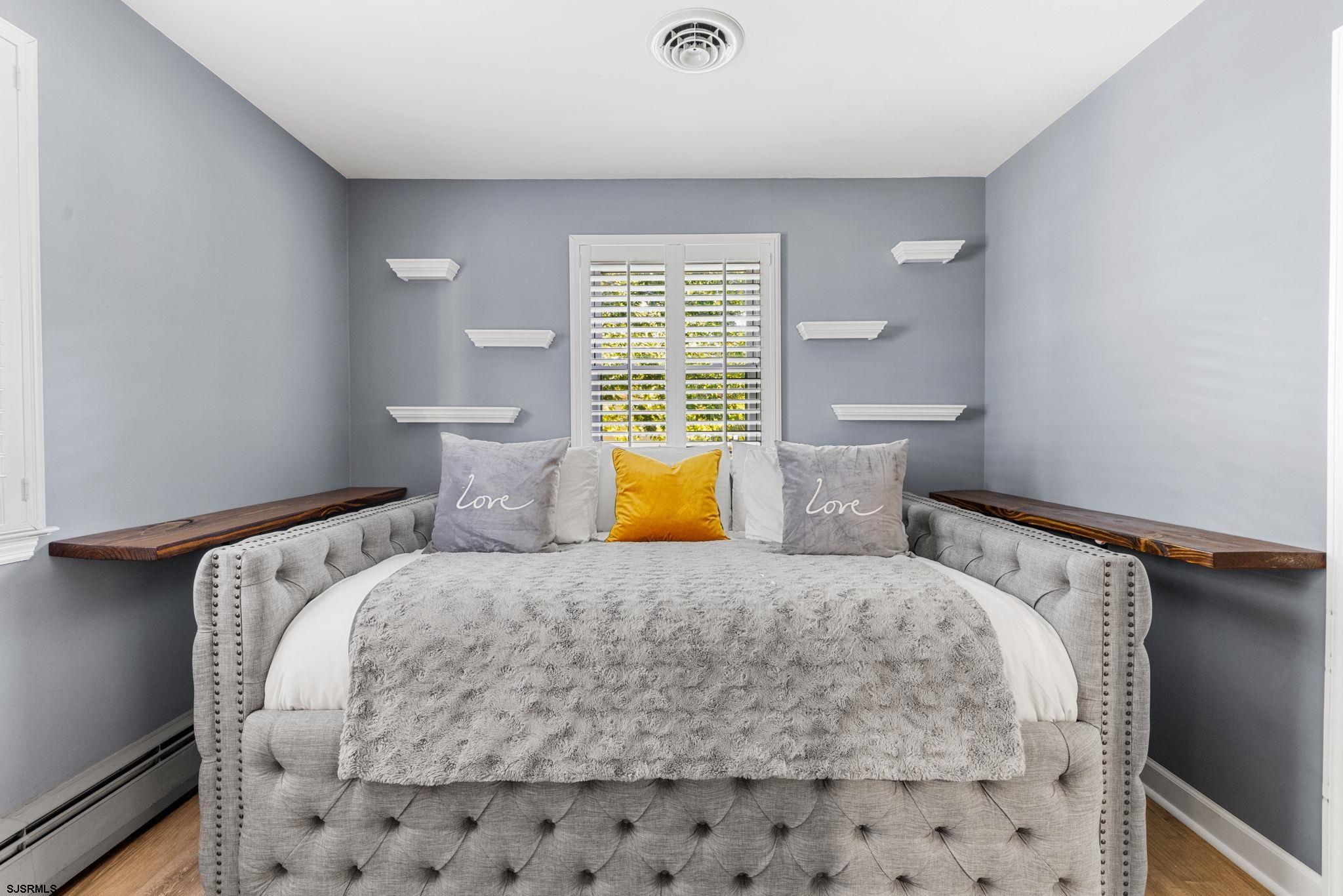 210 Mill Road Absecon, NJ 08201 - Photo 21 of 52 a bedroom with a bed and chair