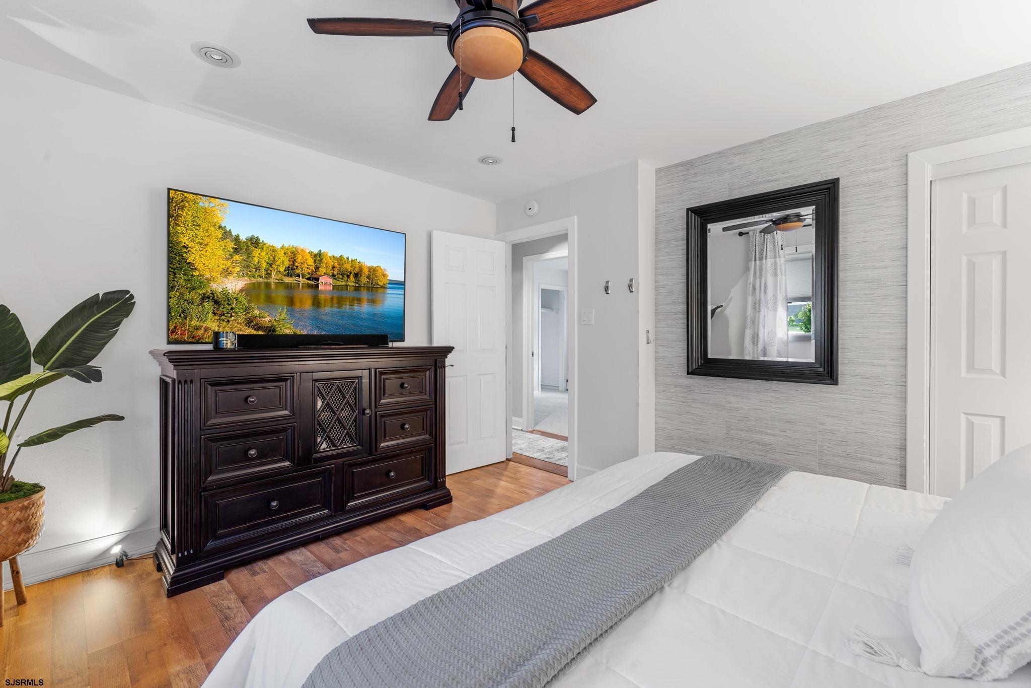 210 Mill Road Absecon, NJ 08201 - Photo 22 of 52 a living room with furniture and a flat screen tv