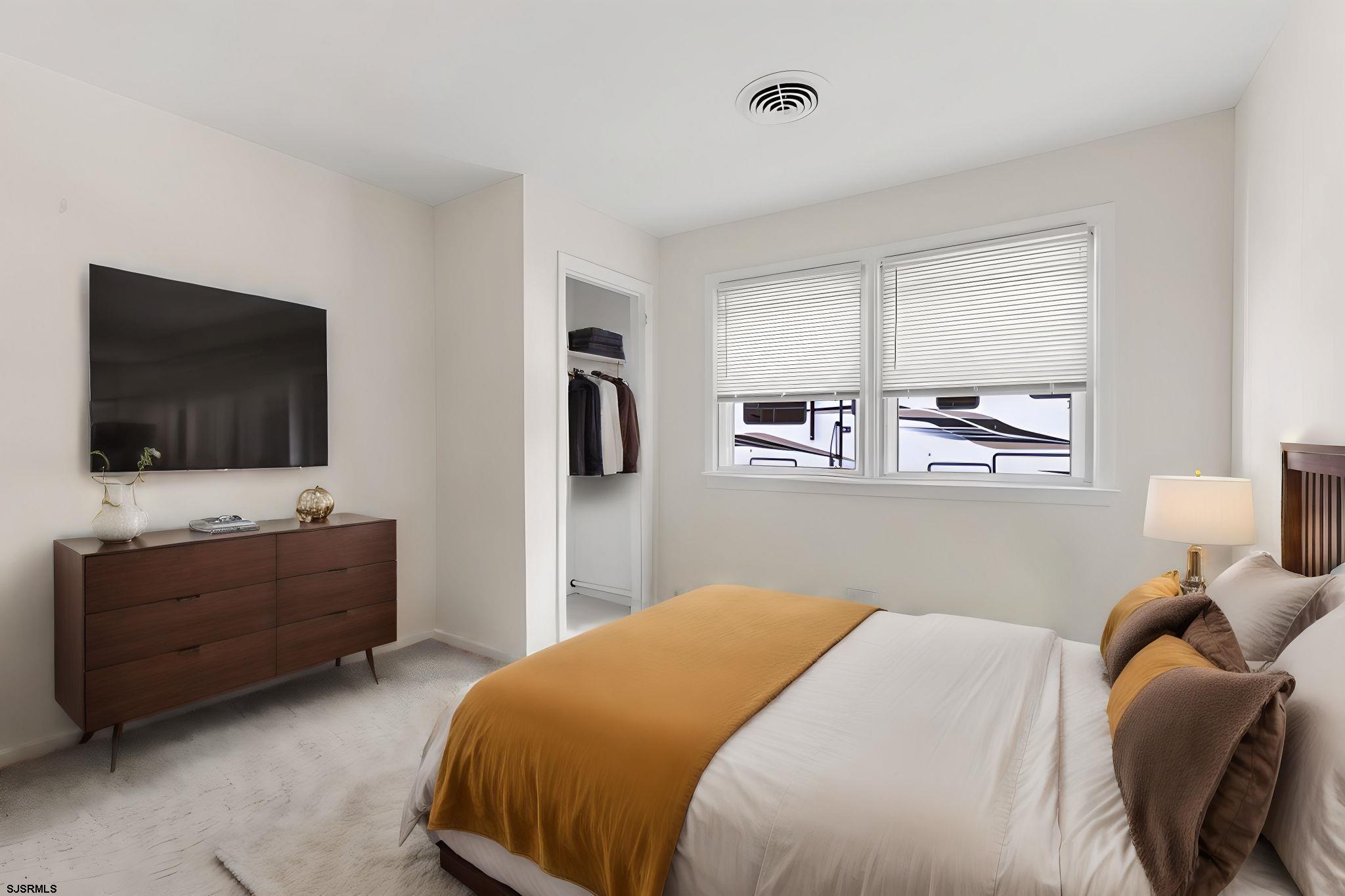 210 Mill Road Absecon, NJ 08201 - Photo 23 of 52 a bedroom with a bed and a flat screen tv