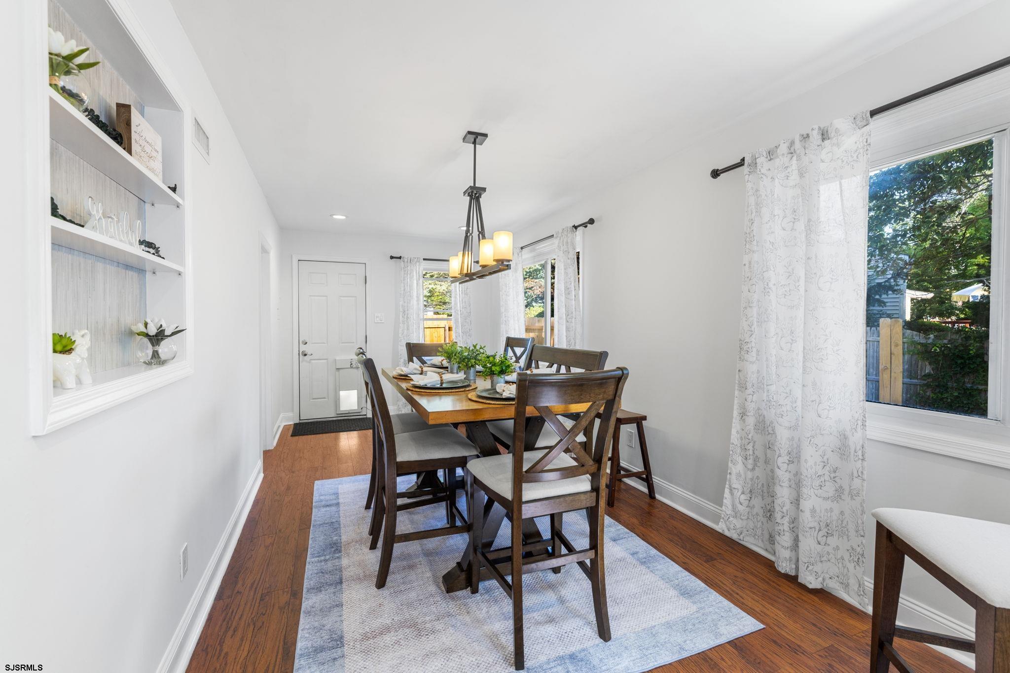 210 Mill Road Absecon, NJ 08201 - Photo 25 of 52 a view of a dining room with furniture and wooden floor