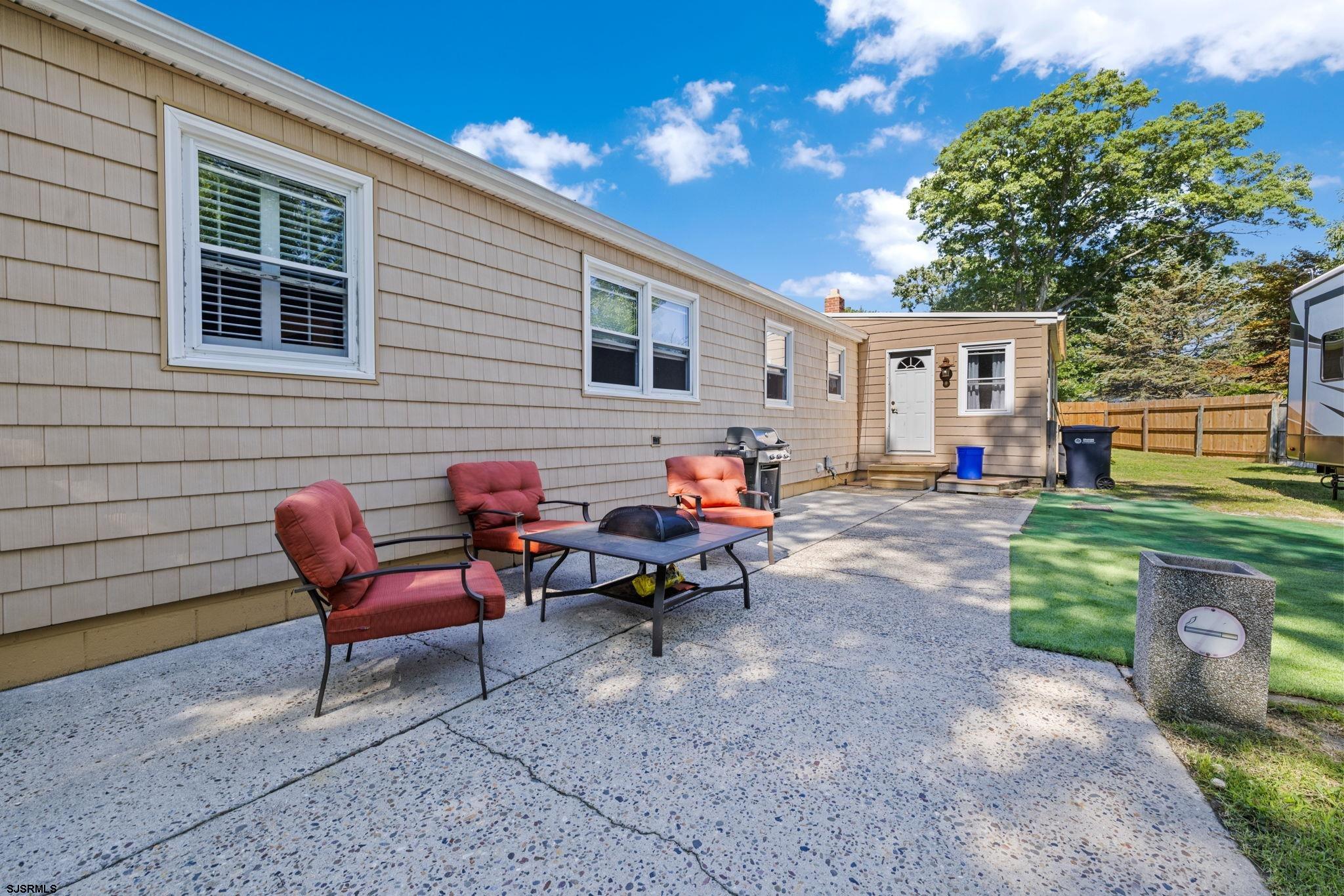 210 Mill Road Absecon, NJ 08201 - Photo 36 of 52 a backyard of a house with barbeque oven table and chairs