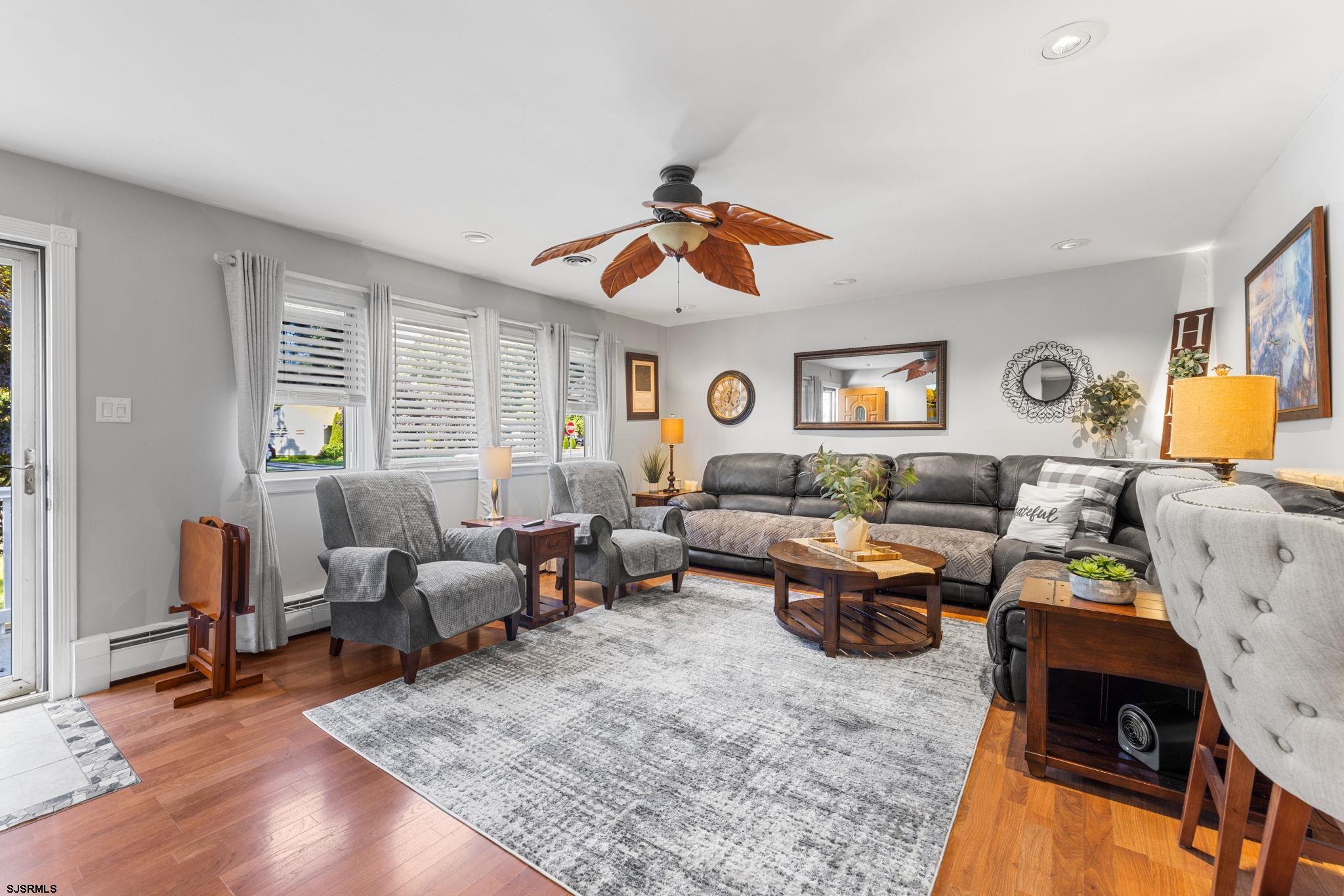 210 Mill Road Absecon, NJ 08201 - Photo 7 of 52 a living room with furniture and wooden floor