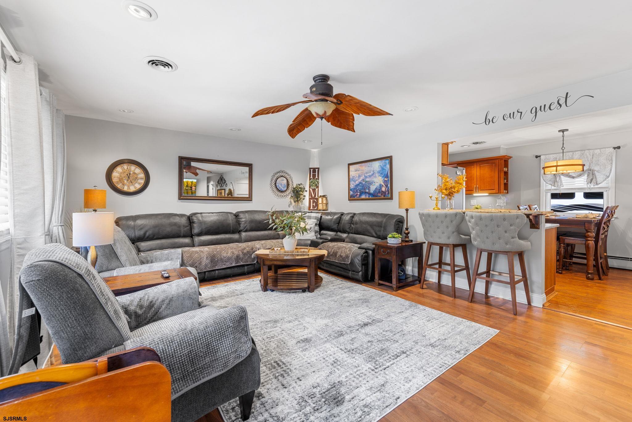 210 Mill Road Absecon, NJ 08201 - Photo 8 of 52 a living room with furniture wooden floor and a window
