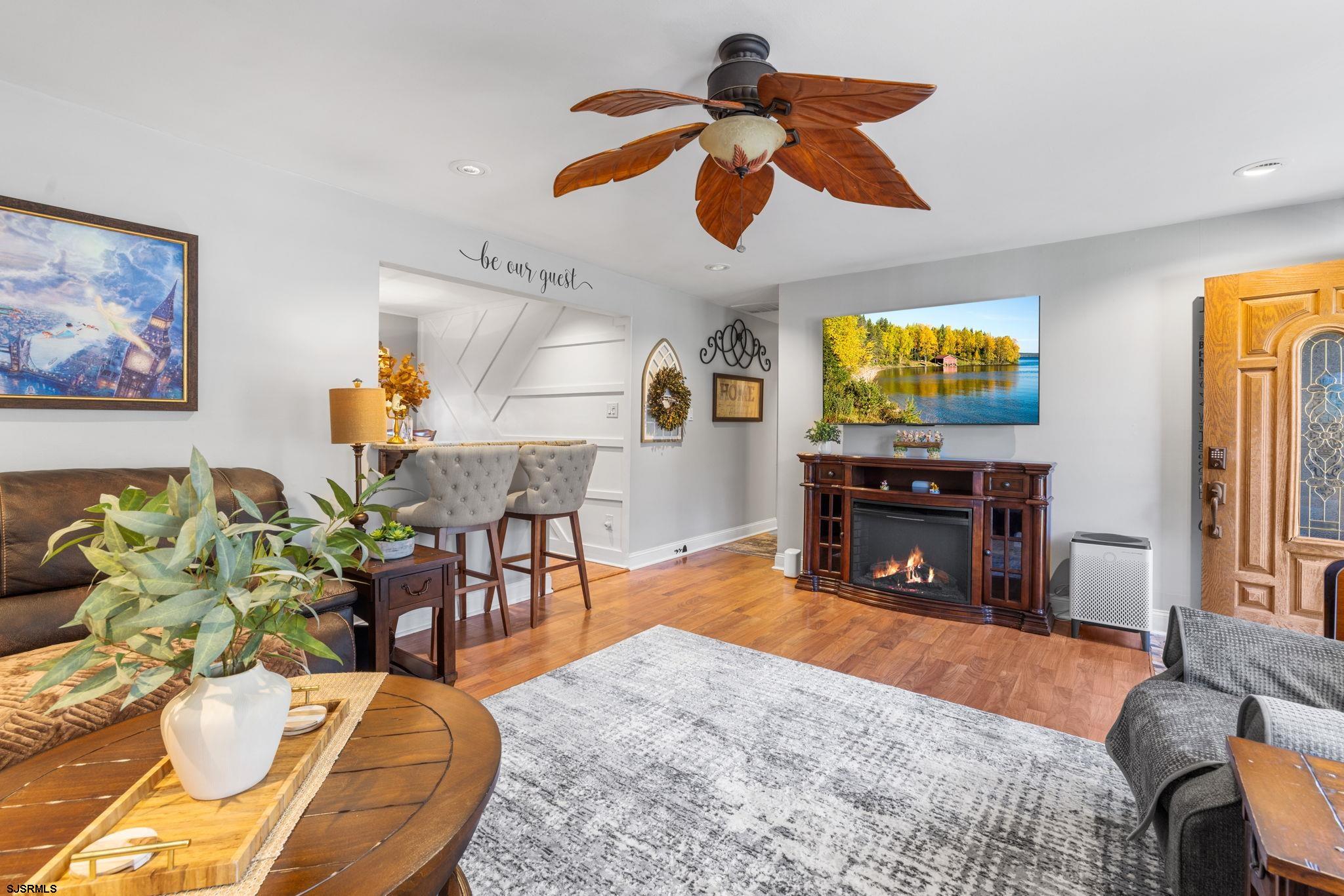 210 Mill Road Absecon, NJ 08201 - Photo 9 of 52 a living room with furniture and a flat screen tv