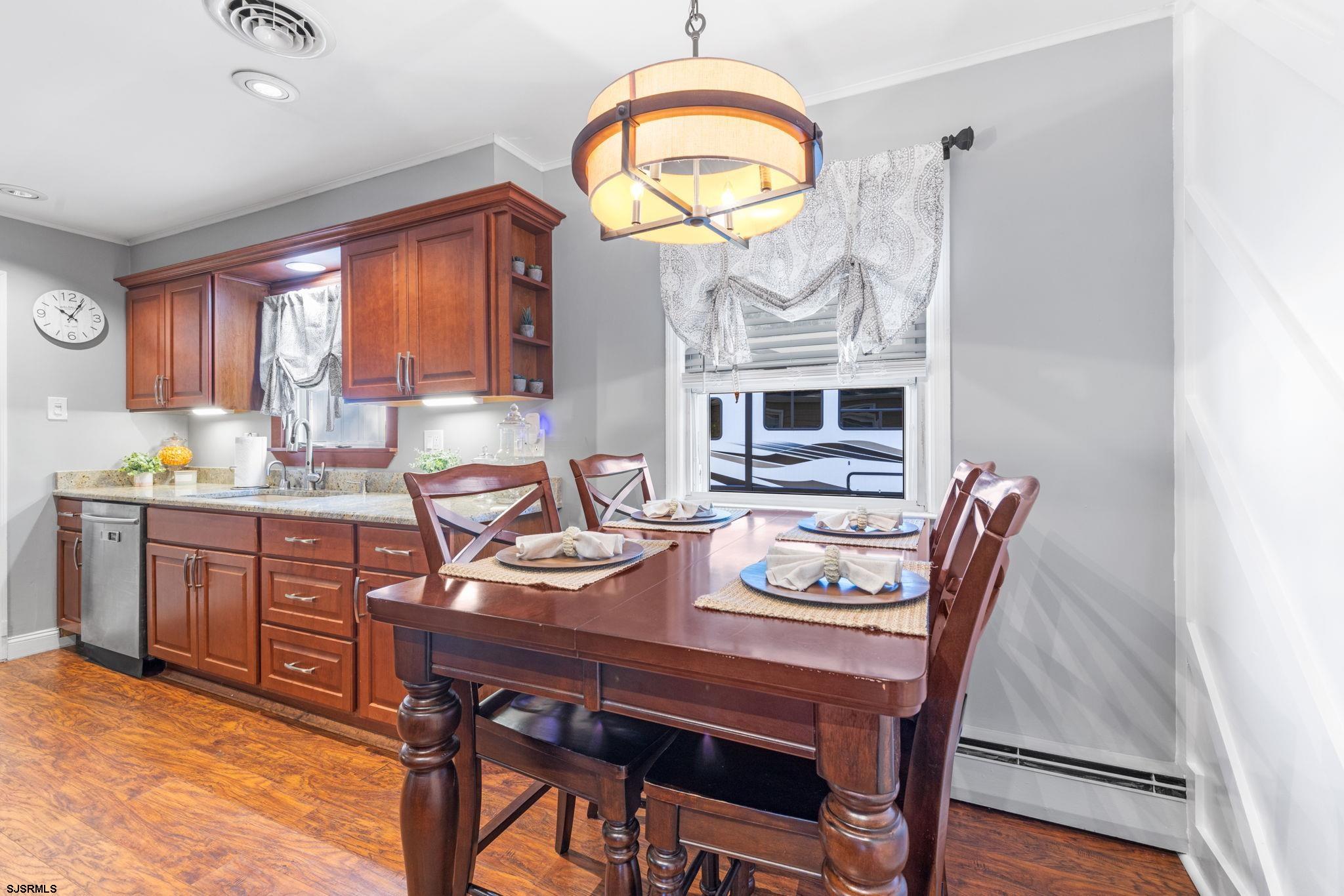 210 Mill Road Absecon, NJ 08201 - Photo 10 of 52 a view of a dining room with furniture window and wooden floor