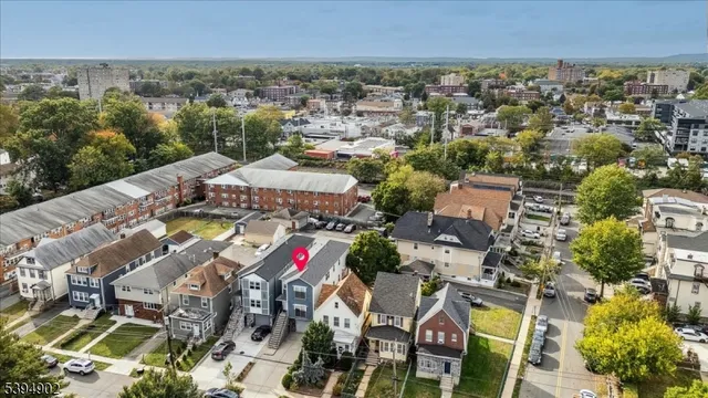 an aerial view of a city with lots of residential buildings