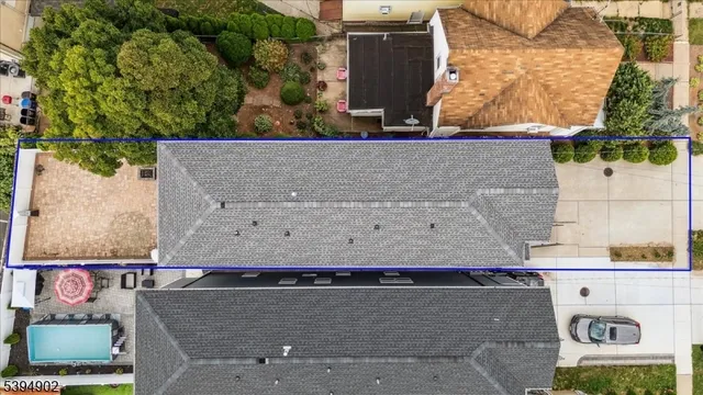 an aerial view of residential house with outdoor space and parking