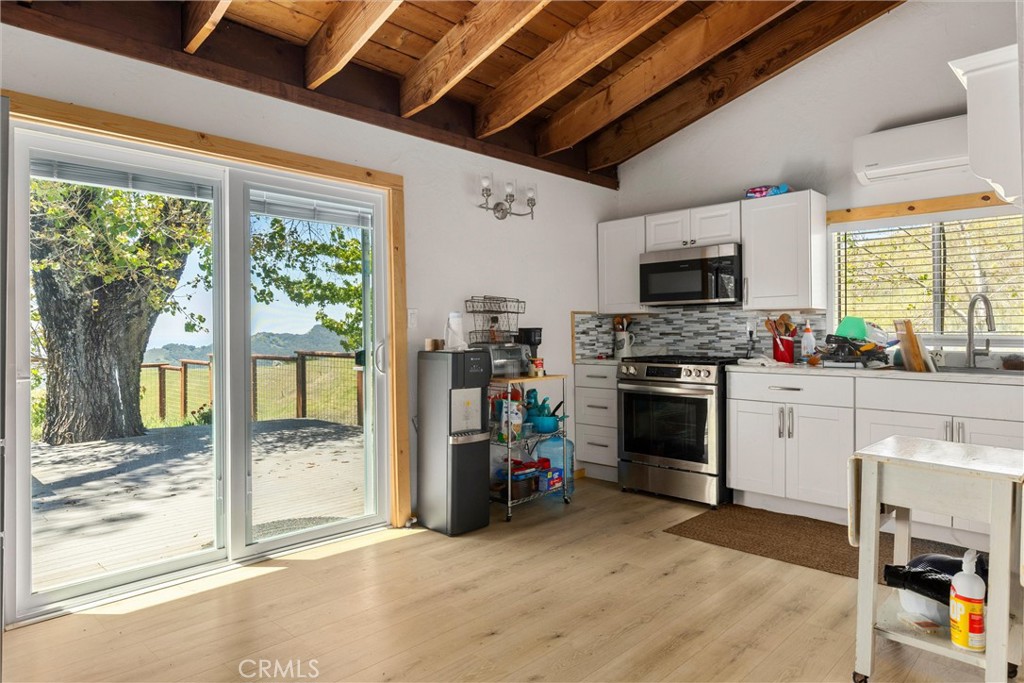 3510 Cypress Mountain Road Templeton, CA 93465 - Photo 12 of 44 a kitchen with a stove a sink and a refrigerator
