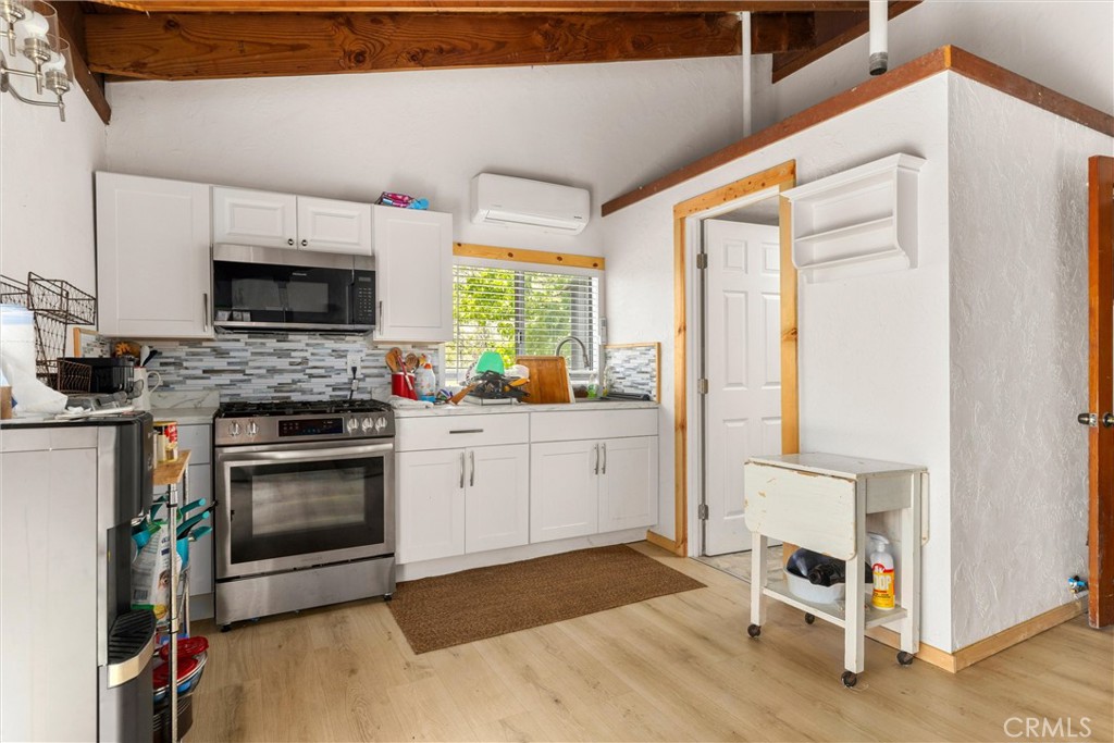 3510 Cypress Mountain Road Templeton, CA 93465 - Photo 13 of 44 a kitchen with a stove a sink and a refrigerator