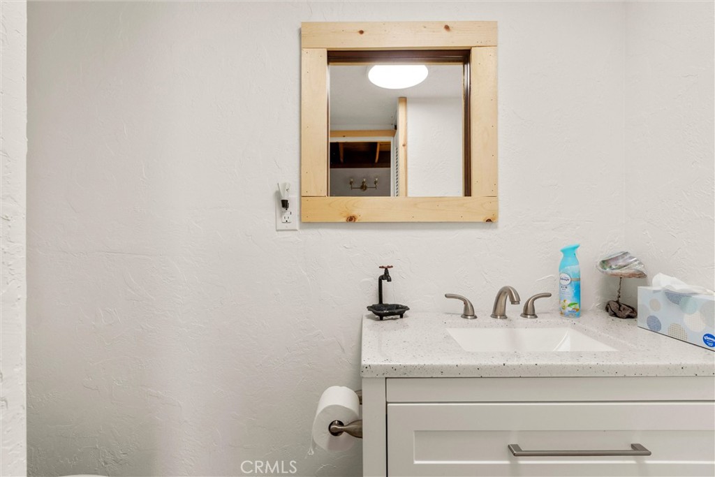 3510 Cypress Mountain Road Templeton, CA 93465 - Photo 17 of 44 a bathroom with a sink and a mirror