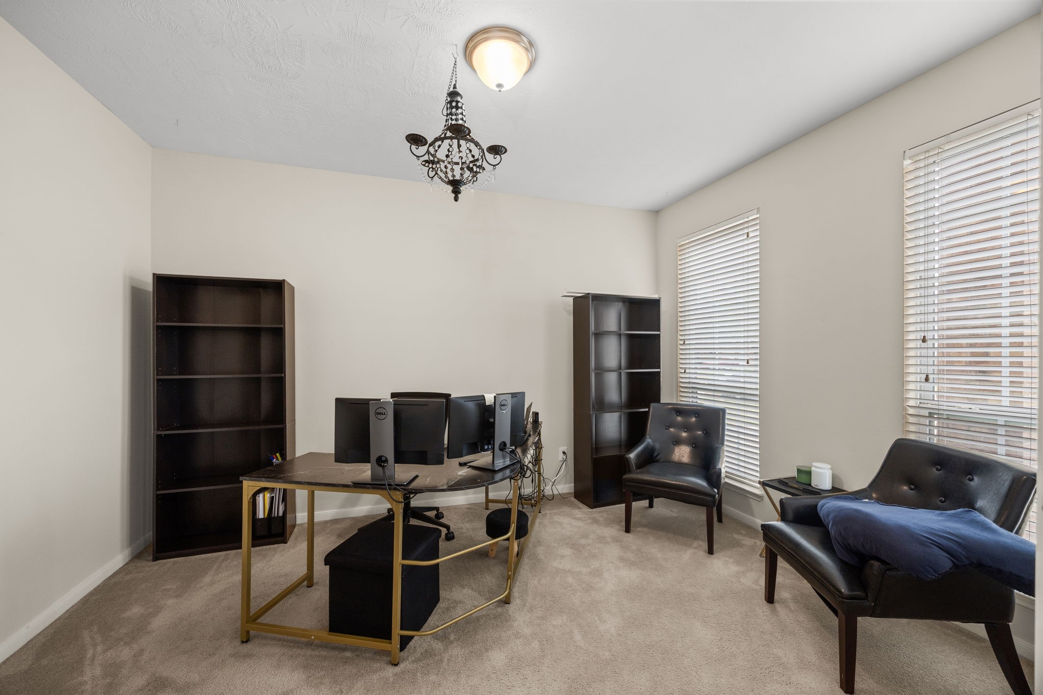 6719 Latchmore Lane Houston, TX 77049 - Photo 21 of 46 a view of a livingroom with workspace and a window