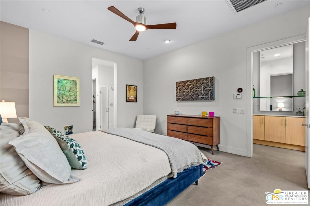 4201 Amber Lane Palm Springs, CA 92262 - Photo 15 of 55 a bedroom with a bed and a large mirror