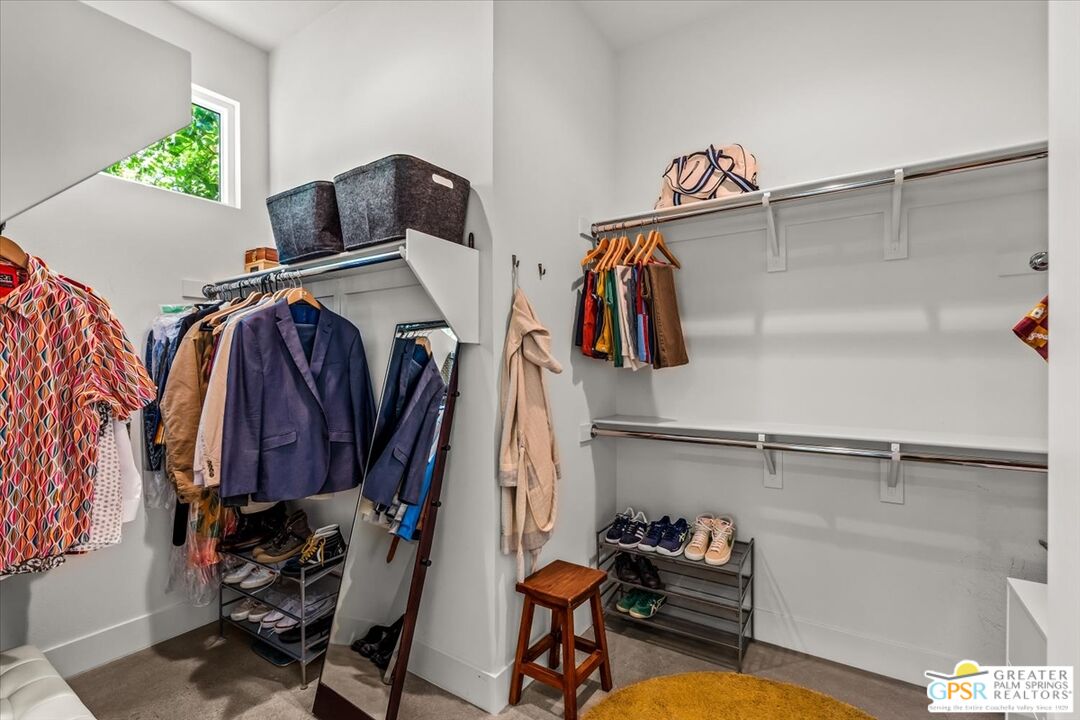 4201 Amber Lane Palm Springs, CA 92262 - Photo 19 of 55 a view of walk in closet with clothes and shoes