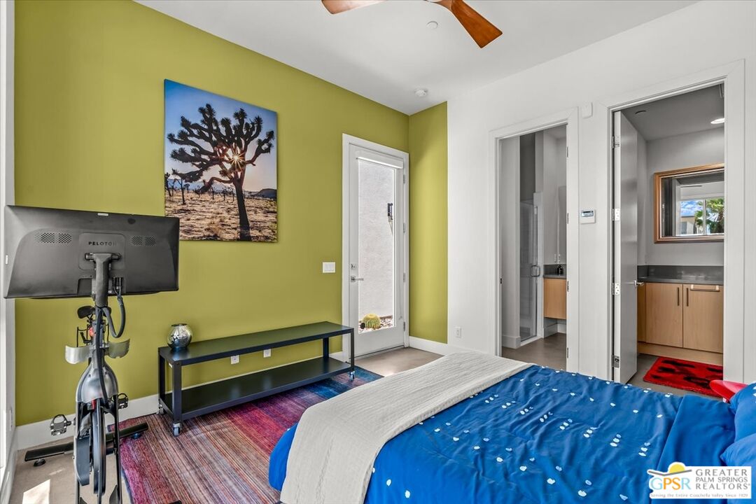 4201 Amber Lane Palm Springs, CA 92262 - Photo 20 of 55 a bedroom with a bed and wooden floor