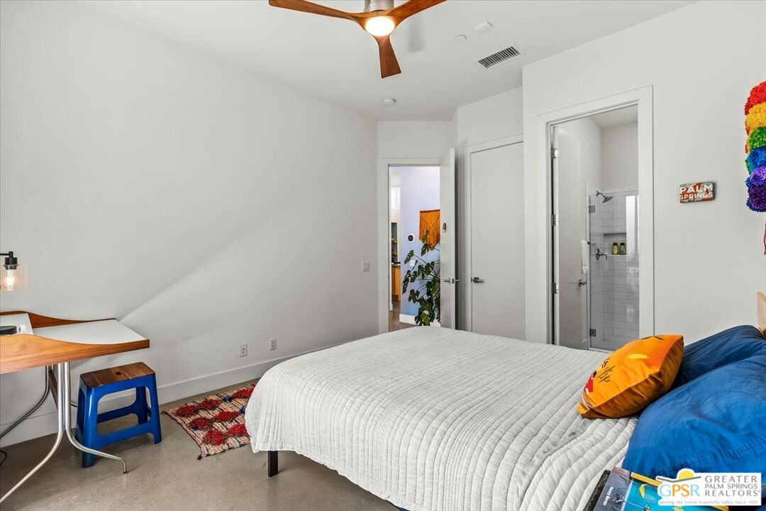 4201 Amber Lane Palm Springs, CA 92262 - Photo 28 of 55 a bedroom with a bed and a dresser in it