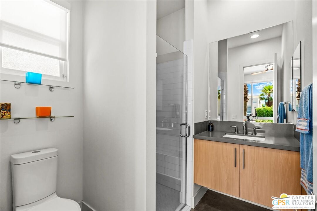 4201 Amber Lane Palm Springs, CA 92262 - Photo 29 of 55 a bathroom with a granite countertop sink and a mirror