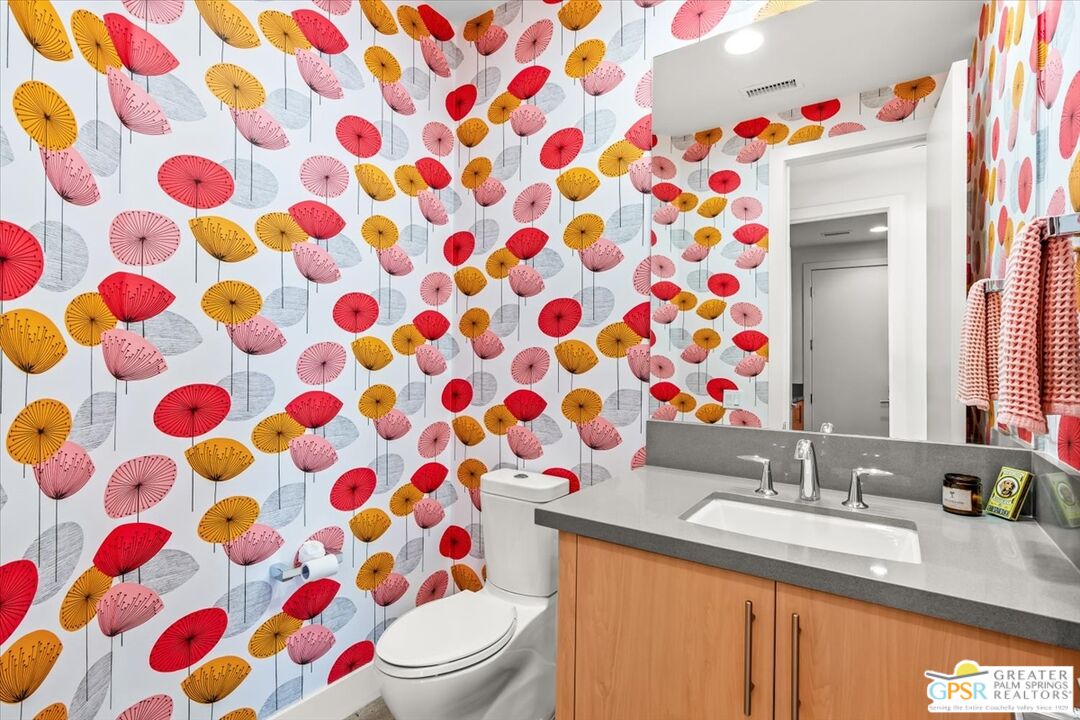 4201 Amber Lane Palm Springs, CA 92262 - Photo 30 of 55 a bathroom with a sink toilet and a mirror