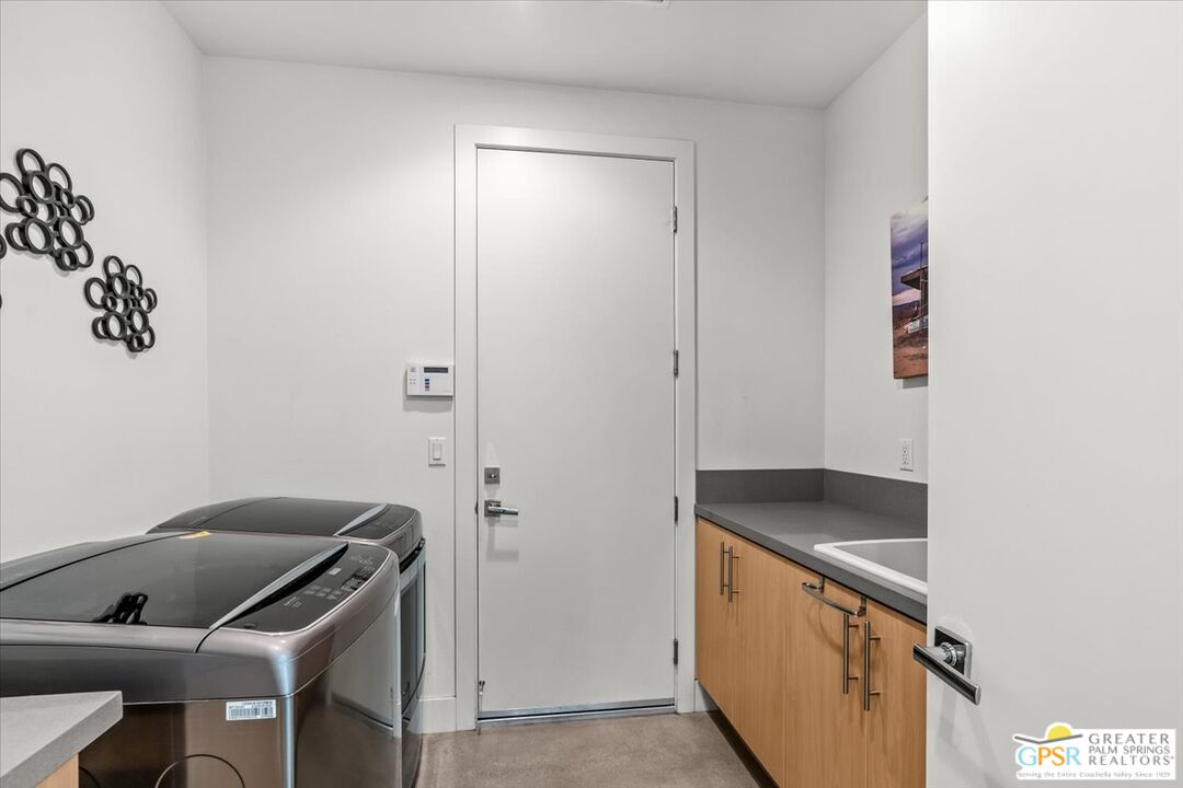 4201 Amber Lane Palm Springs, CA 92262 - Photo 31 of 55 a kitchen with a refrigerator and stove