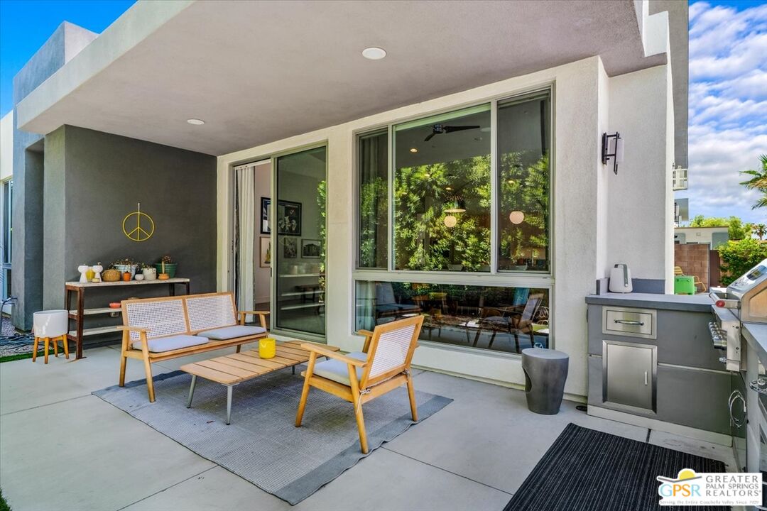 4201 Amber Lane Palm Springs, CA 92262 - Photo 43 of 55 a outdoor space with a large window and furniture