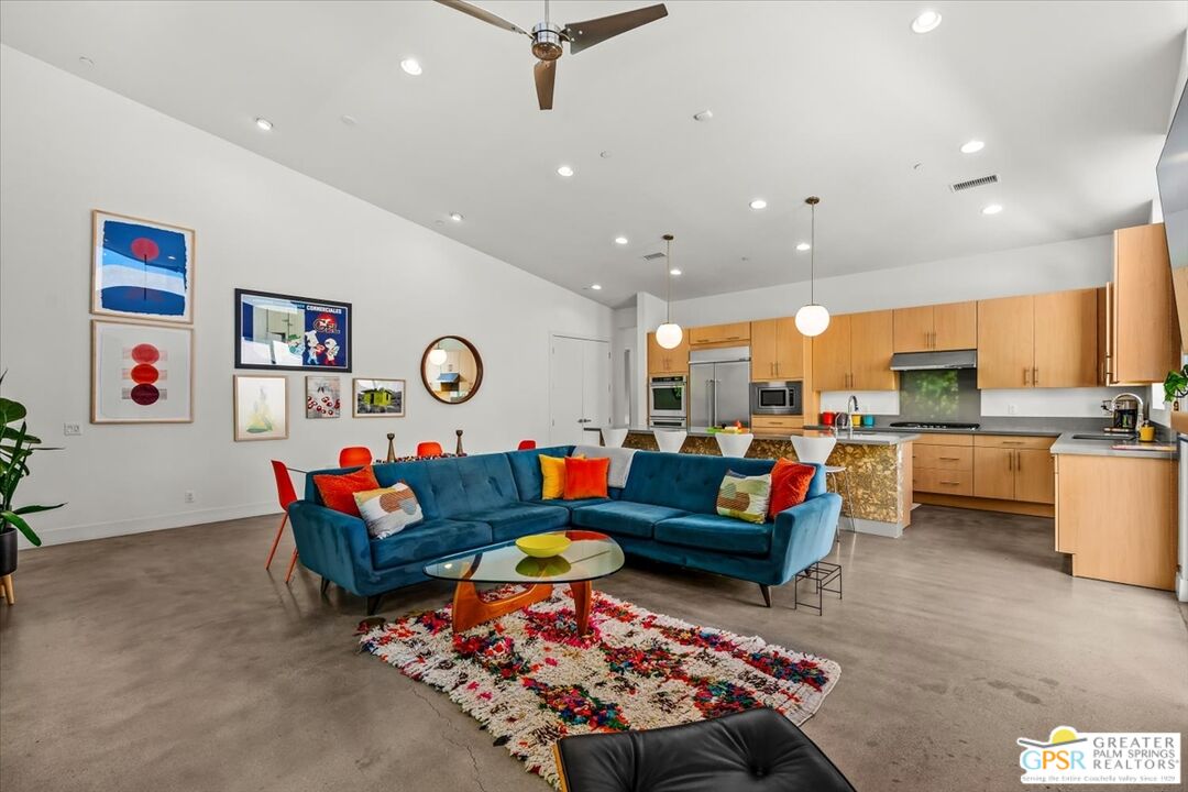 4201 Amber Lane Palm Springs, CA 92262 - Photo 6 of 55 a living room with lots of furniture and kitchen view