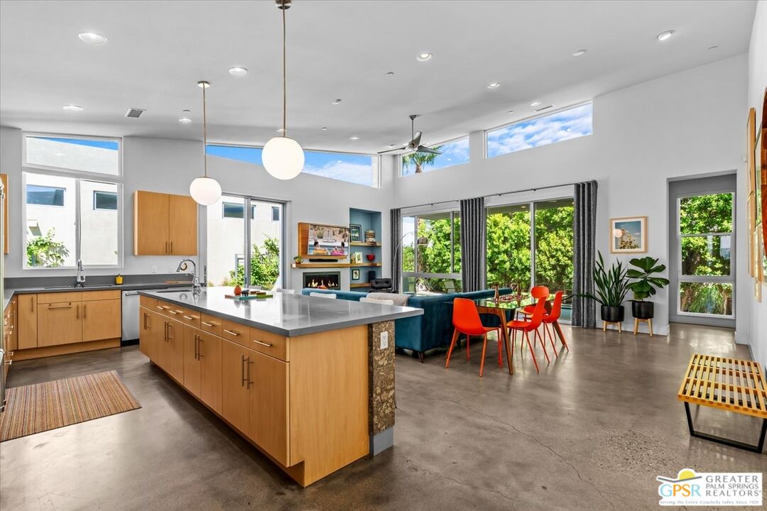 4201 Amber Lane Palm Springs, CA 92262 - Photo 10 of 55 a kitchen with stainless steel appliances kitchen island furniture and a large window