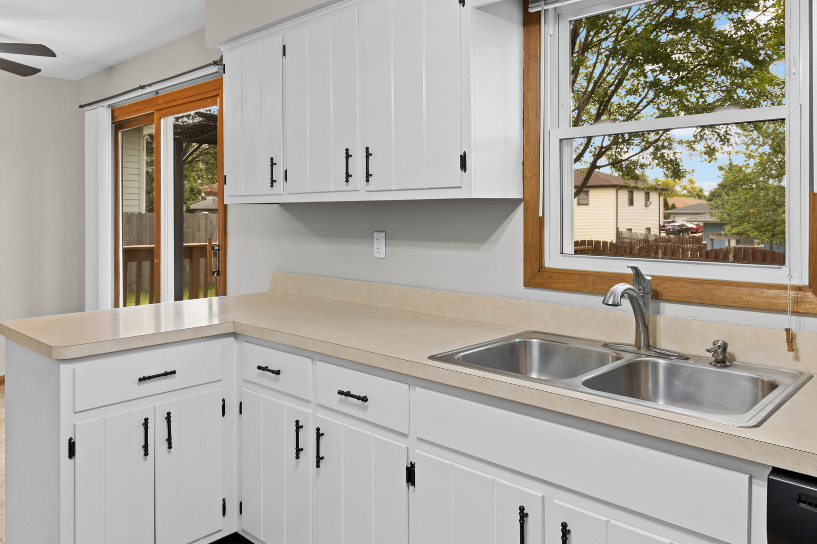 1010 Southgate Road New Lenox, IL 60451 - Photo 5 of 30 a kitchen with granite countertop white cabinets and sink