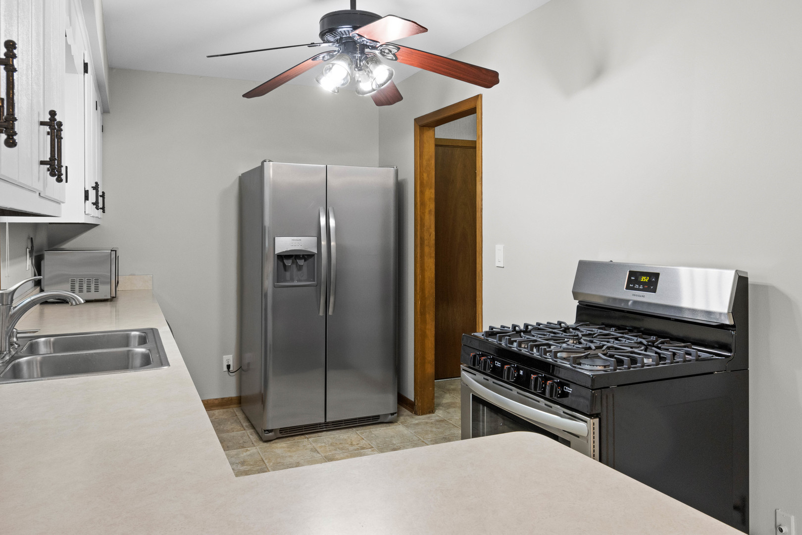 1010 Southgate Road New Lenox, IL 60451 - Photo 6 of 30 a kitchen with stainless steel appliances granite countertop a refrigerator and a sink