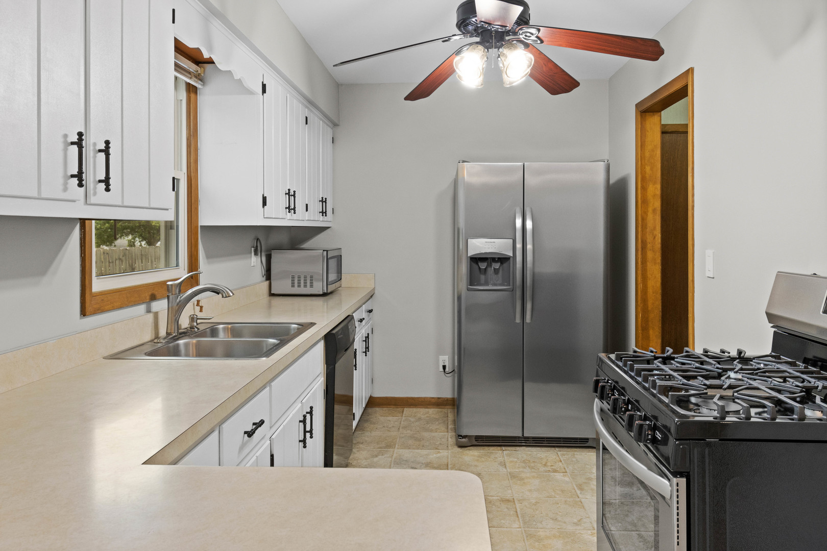 1010 Southgate Road New Lenox, IL 60451 - Photo 7 of 30 a kitchen with kitchen island granite countertop a sink stainless steel appliances and cabinets