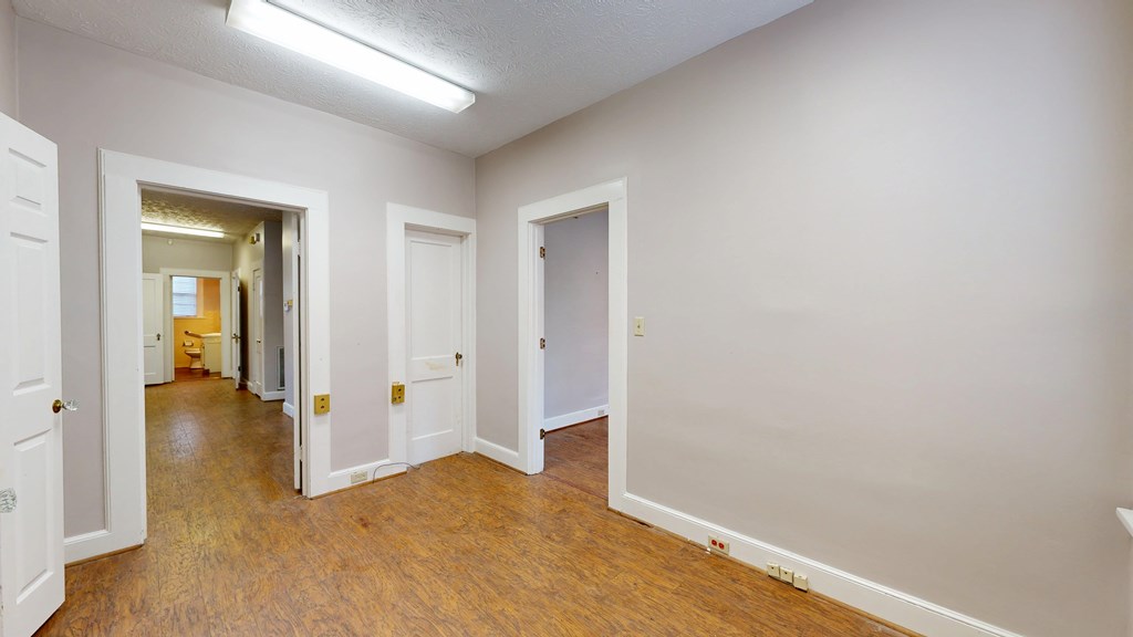 1237 Peacock Avenue Columbus, GA 31906 - Photo 15 of 52 an empty room with wooden floor and closet