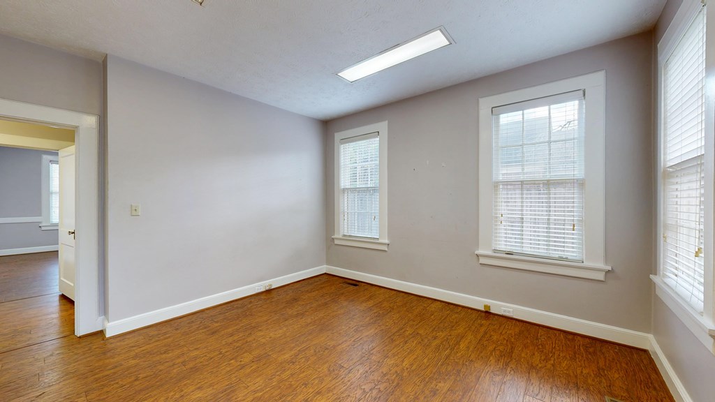 1237 Peacock Avenue Columbus, GA 31906 - Photo 24 of 52 a view of an empty room with wooden floor and a window