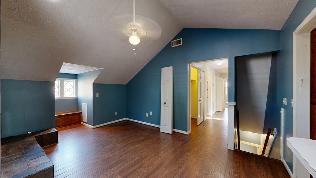 1237 Peacock Avenue Columbus, GA 31906 - Photo 28 of 52 an empty room with wooden floor and windows