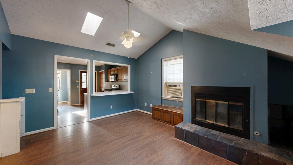 1237 Peacock Avenue Columbus, GA 31906 - Photo 30 of 52 a view of a livingroom with wooden floor and a fireplace