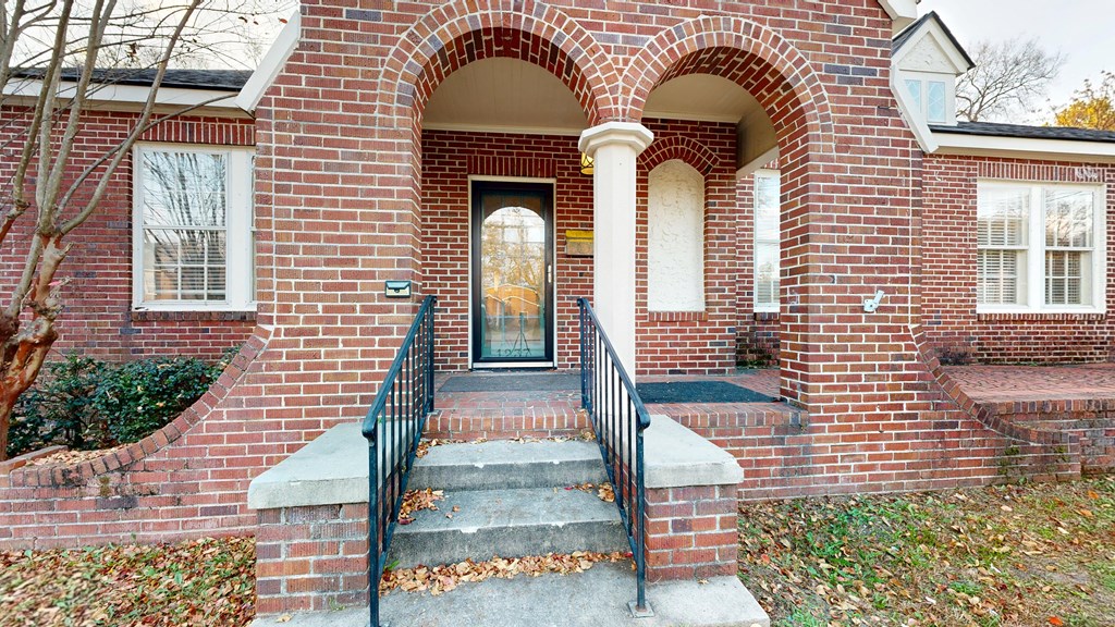 1237 Peacock Avenue Columbus, GA 31906 - Photo 3 of 52 a front view of a house with a garden