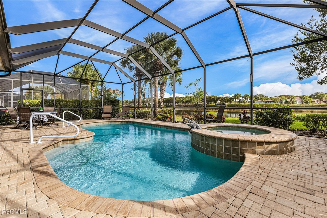 3900 Lakeview Isle Court Fort Myers, FL 33905 - Photo 12 of 31 a view of a swimming pool with a patio