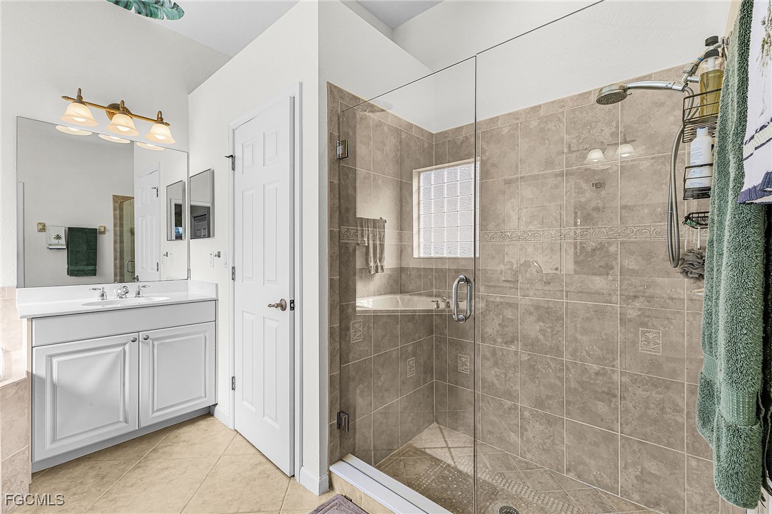 3900 Lakeview Isle Court Fort Myers, FL 33905 - Photo 17 of 31 a bathroom with a shower and a sink