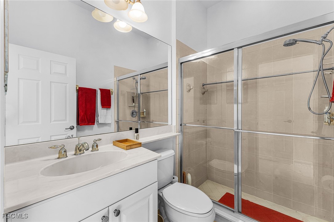 3900 Lakeview Isle Court Fort Myers, FL 33905 - Photo 19 of 31 a bathroom with a sink vanity granite and toilet